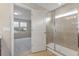 Bathroom with a glass-doored shower and an open door to the bedroom with neighborhood views at 2682 Mead Ave, St Cloud, FL 34771