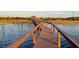 Picturesque boardwalk stretching over the water offering a tranquil scene of calm waters at 2682 Mead Ave, St Cloud, FL 34771