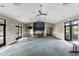 Spacious clubhouse room with modern ceiling fans, a kitchenette, and large windows at 2682 Mead Ave, St Cloud, FL 34771