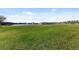 View of the community green space with pond and fountain, offering a serene and picturesque outdoor amenity at 2682 Mead Ave, St Cloud, FL 34771