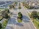 Wide community street lined with mature trees, showcasing well-maintained landscaping and neighborhood charm at 2682 Mead Ave, St Cloud, FL 34771