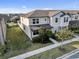 Charming townhome with manicured lawn, blooming shrubbery, and a well-maintained exterior at 2682 Mead Ave, St Cloud, FL 34771