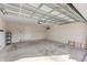 Spacious two-car garage with exposed ceiling and cinder block walls at 2682 Mead Ave, St Cloud, FL 34771