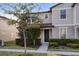 Charming two-story home featuring neutral siding, well-kept landscaping, and a welcoming front entrance at 2682 Mead Ave, St Cloud, FL 34771