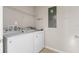 Laundry room with a washing machine, a dryer, and white shelving at 2682 Mead Ave, St Cloud, FL 34771