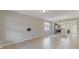 Open living space with tile flooring, a window and views of the kitchen at 2682 Mead Ave, St Cloud, FL 34771