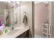 Bathroom featuring a vanity with a white countertop and a tiled shower at 302 Vista Loop, Davenport, FL 33897