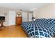 Spacious bedroom with hardwood floors, multiple closets, and a comfortable bed at 302 Vista Loop, Davenport, FL 33897