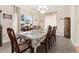 Elegant dining room featuring a large window and chandelier at 302 Vista Loop, Davenport, FL 33897