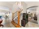 Inviting home entrance with a view of the fireplace and staircase at 302 Vista Loop, Davenport, FL 33897