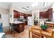Spacious kitchen features an island, stainless steel appliances, and an adjacent dining area at 302 Vista Loop, Davenport, FL 33897