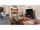 Comfortable living room with a fireplace and media center at 302 Vista Loop, Davenport, FL 33897