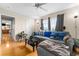 Inviting living room with hardwood floors, neutral walls, and ample natural light at 302 Vista Loop, Davenport, FL 33897