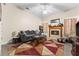 Cozy living room featuring a decorative fireplace and neutral-toned walls at 302 Vista Loop, Davenport, FL 33897