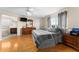 Spacious main bedroom with hardwood floors, large windows, and a bathroom ensuite at 302 Vista Loop, Davenport, FL 33897