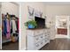 A bedroom featuring a walk-in closet and ensuite bathroom with a white dresser at 302 Vista Loop, Davenport, FL 33897
