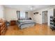 Bright main bedroom with hardwood floors, large windows, and neutral wall color at 302 Vista Loop, Davenport, FL 33897
