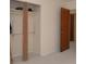 Bedroom featuring an closet, beige carpet, and a paneled door at 3045 Cecelia Dr, Apopka, FL 32703