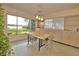 Bright dining area with lake views and built in cabinetry, perfect for entertaining guests at 3045 Cecelia Dr, Apopka, FL 32703