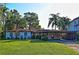 Charming single story home with a well-maintained lawn and mature trees at 3045 Cecelia Dr, Apopka, FL 32703