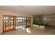 Open living room with sliding doors to backyard and tranquil lake views at 3045 Cecelia Dr, Apopka, FL 32703