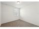 Bright bedroom with neutral carpet, white walls, and a window for natural light at 3797 Giorgio Dr, Winter Haven, FL 33884