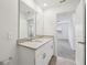 Bright bathroom with double sinks, granite countertops, and tile flooring at 3845 Giorgio Dr, Winter Haven, FL 33884