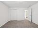 Bright bedroom with plush carpeting and a closet with sliding doors at 3845 Giorgio Dr, Winter Haven, FL 33884