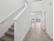 Bright entryway with staircase, tile floors, and an open view to a naturally lit living space at 3845 Giorgio Dr, Winter Haven, FL 33884