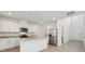 Well-lit kitchen with stainless steel appliances, granite countertops, and a kitchen island at 3845 Giorgio Dr, Winter Haven, FL 33884