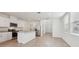 Kitchen and living area featuring granite countertops, stainless steel appliances, and tile flooring at 3845 Giorgio Dr, Winter Haven, FL 33884