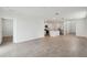 Open-concept living space featuring tile flooring and a modern kitchen with stainless appliances at 3845 Giorgio Dr, Winter Haven, FL 33884