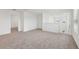 Open living room featuring carpeted floors and natural light at 3845 Giorgio Dr, Winter Haven, FL 33884