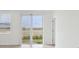 Bright living room features neutral tile floors and sliding glass doors to the outside at 3845 Giorgio Dr, Winter Haven, FL 33884