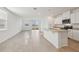 Spacious living area connected to kitchen with tile flooring, bright natural light, and recessed lighting at 3845 Giorgio Dr, Winter Haven, FL 33884
