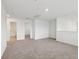 Spacious living room with neutral carpet, and modern lighting at 3845 Giorgio Dr, Winter Haven, FL 33884
