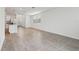 Bright living room featuring neutral tile flooring, recessed lighting, and large windows at 3845 Giorgio Dr, Winter Haven, FL 33884