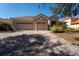 Charming single-story home featuring a three-car garage and a beautifully paved driveway at 3901 Bowfin Trail, Kissimmee, FL 34746