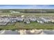 Aerial view of the backyard with a view of nearby construction at 4057 Sagefield Dr, Harmony, FL 34773