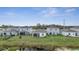 This backyard features a pond and a view of the neighboring houses at 4057 Sagefield Dr, Harmony, FL 34773