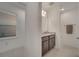Bathroom featuring granite countertop, dark wood cabinets, and tile flooring at 4057 Sagefield Dr, Harmony, FL 34773