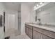 This bathroom features double sinks, granite counters, and updated fixtures at 4057 Sagefield Dr, Harmony, FL 34773
