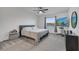 This carpeted main bedroom features a ceiling fan, television, and plenty of natural light at 4057 Sagefield Dr, Harmony, FL 34773