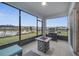 Enjoy this beautiful screened patio overlooking the water, complete with grill and fireplace at 4057 Sagefield Dr, Harmony, FL 34773