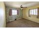 Bedroom features dated decor with patterned wallpaper and a ceiling fan for comfort at 420 W Crystal Dr, Sanford, FL 32773