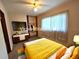 This is a virtual staging of the bedroom, showcasing an updated look with furniture at 420 W Crystal Dr, Sanford, FL 32773