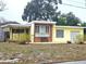Charming single-story home with yellow exterior and brick accents at 420 W Crystal Dr, Sanford, FL 32773