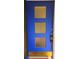 Striking blue front door with decorative glass panels and modern keypad entry at 420 W Crystal Dr, Sanford, FL 32773