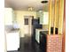 Retro kitchen with green cabinets and black appliances at 420 W Crystal Dr, Sanford, FL 32773