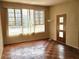 Bright living room with large window and unique parquet flooring at 420 W Crystal Dr, Sanford, FL 32773